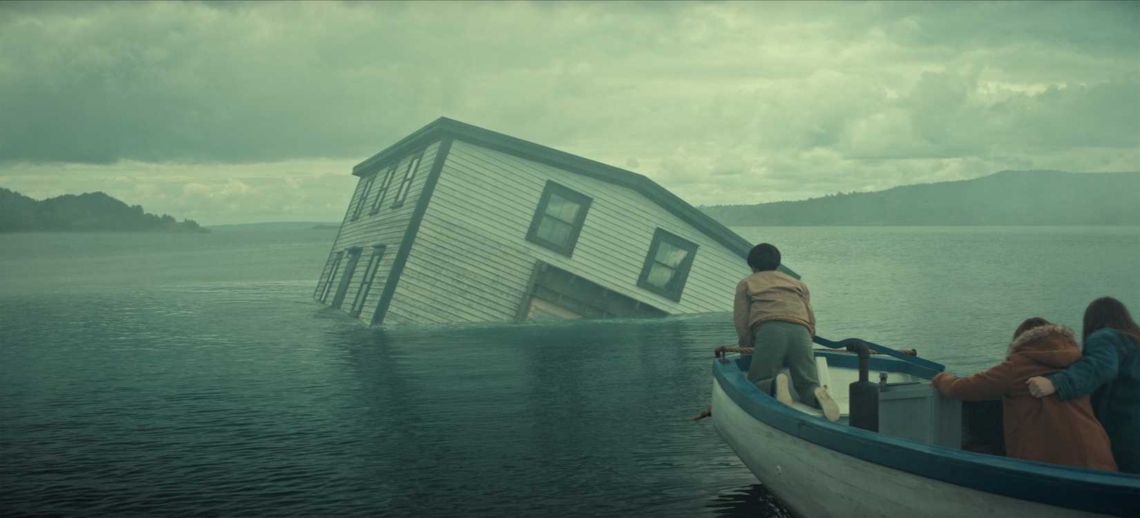 Young Calvin watches his father die in a sinking house in Below