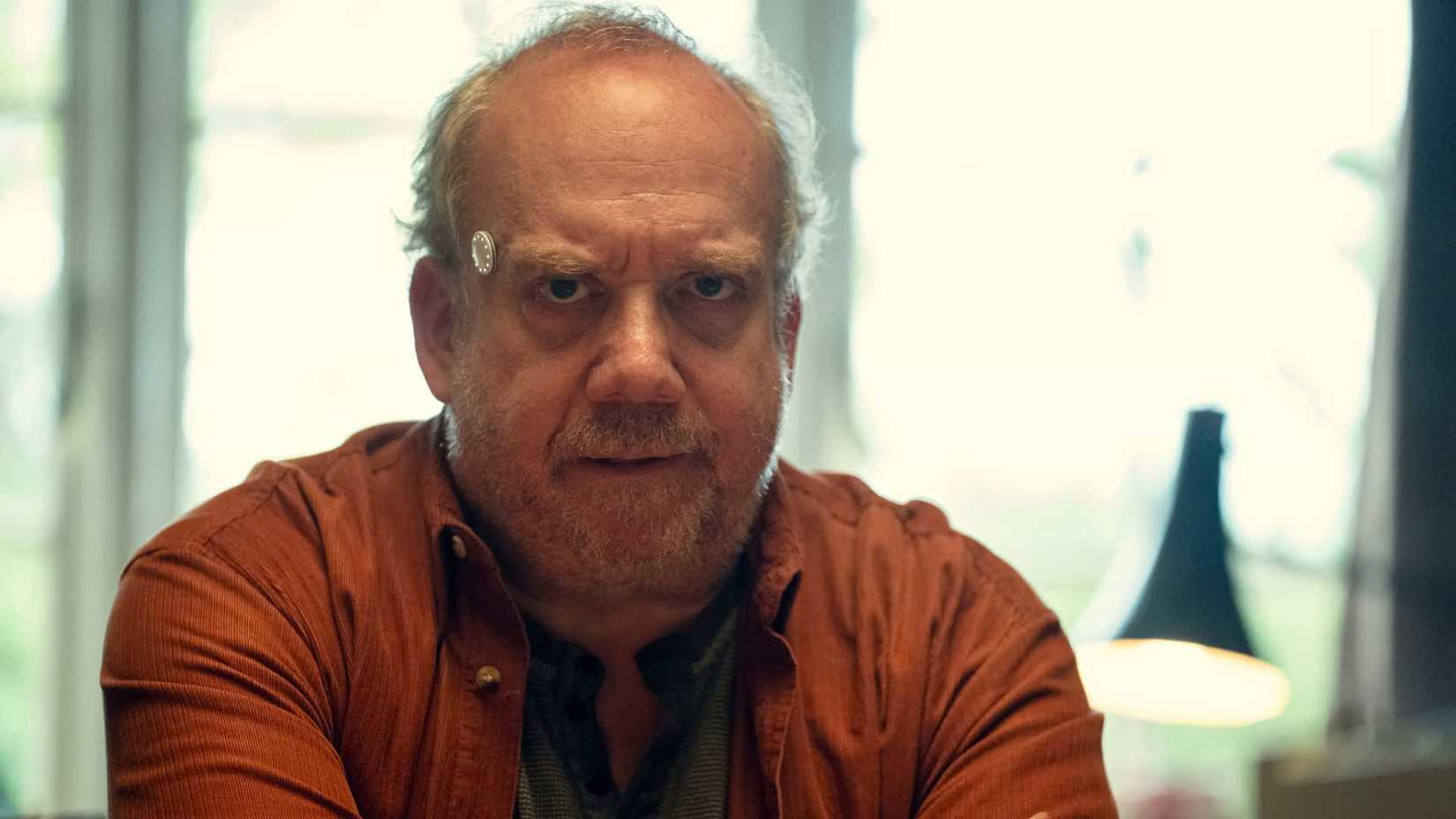Paul Giamatti’s Phillip Connarty looking grumpy in Black Mirror’s “Eulogy” episode