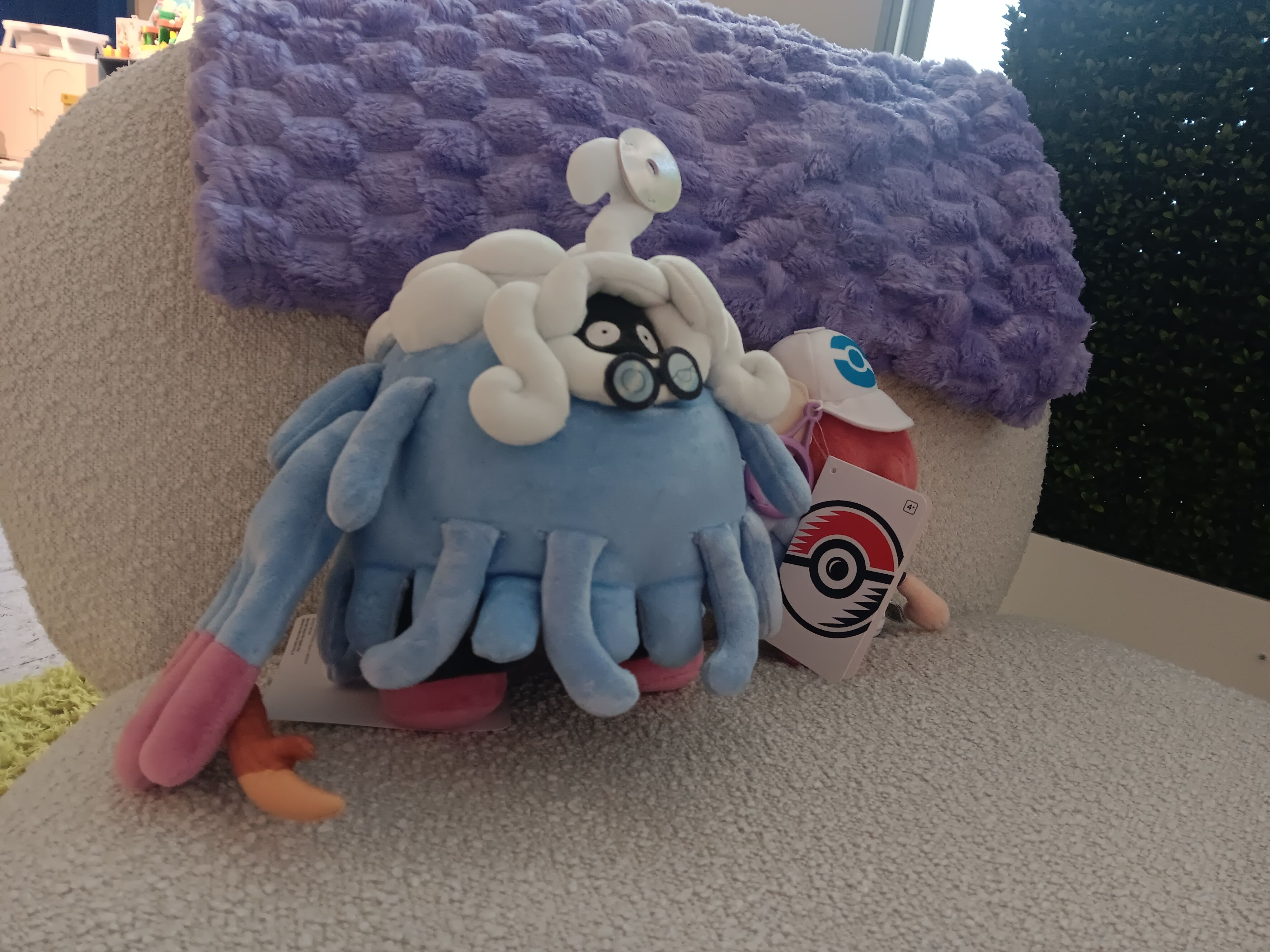 Pofessor Tangrowth plushie on a plush chair at the Nintendo Holiday Showcase 2026