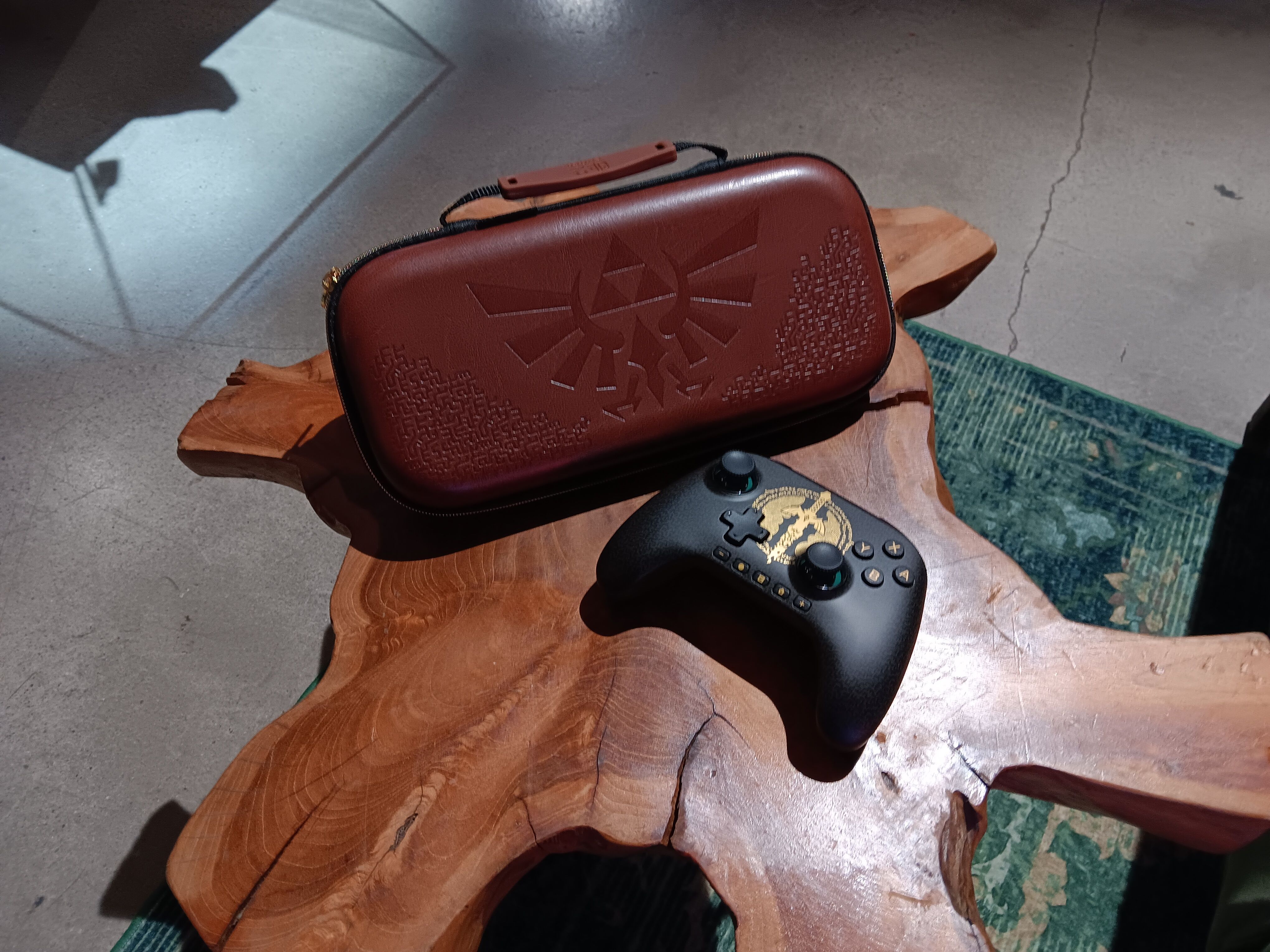 Legend of Zelda Switch 2 controller and carrying case on a wooden table