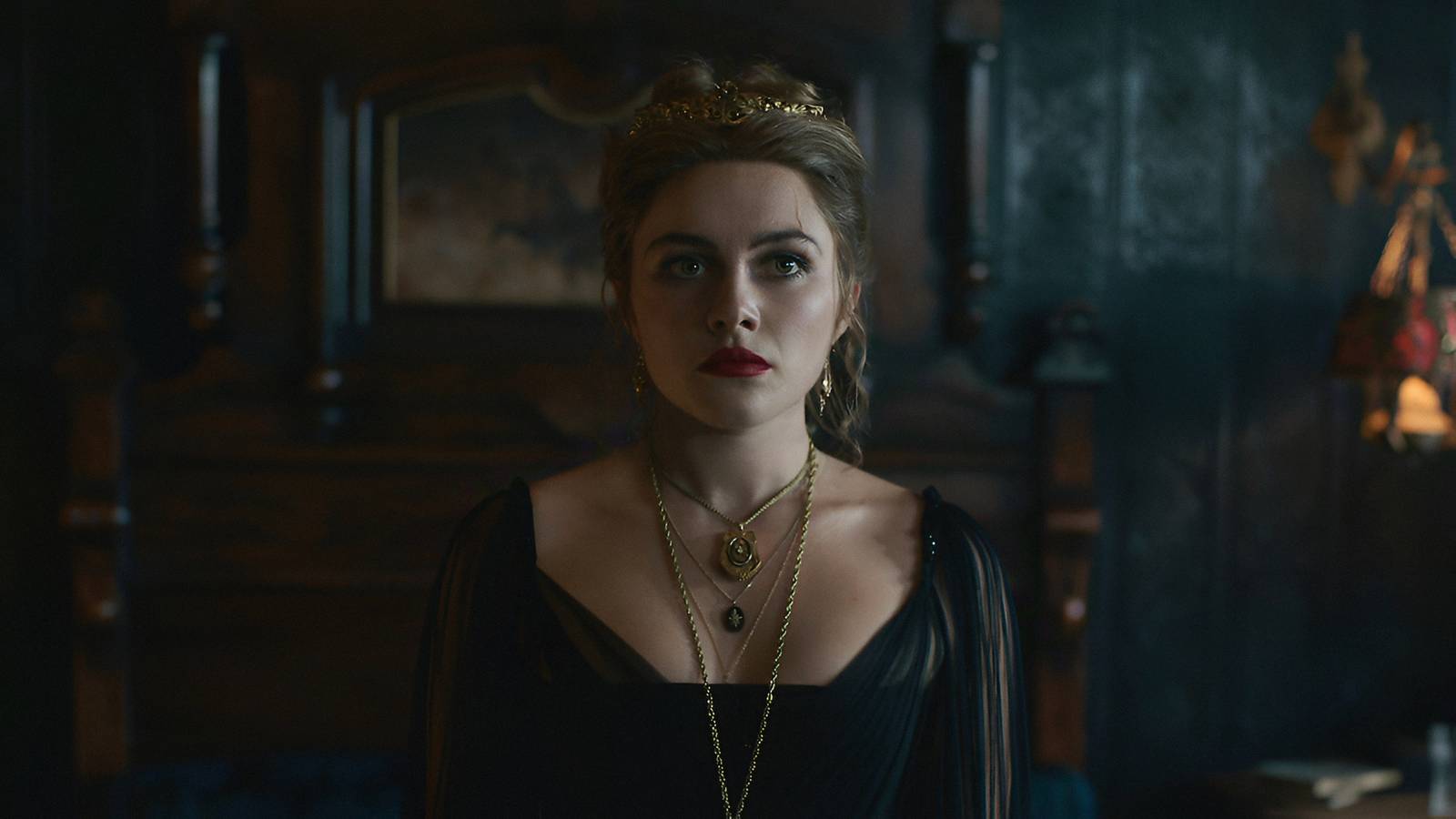 Florence Pugh’s Cathy Ames standing with her eyes wide open in Netflix’s East of Eden