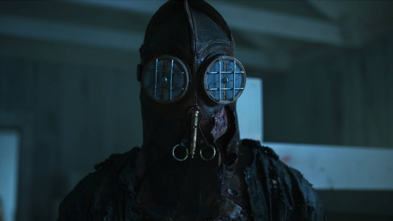 A close-up of the masked killer in In a Violent Nature Part 2