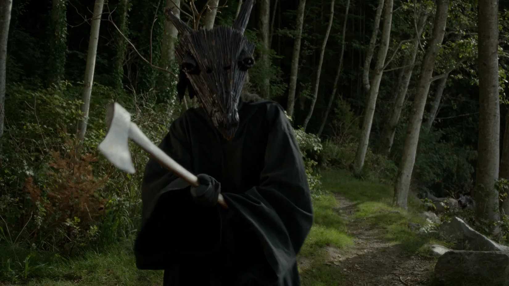 A masked killer holds an axe in Dead of Summer