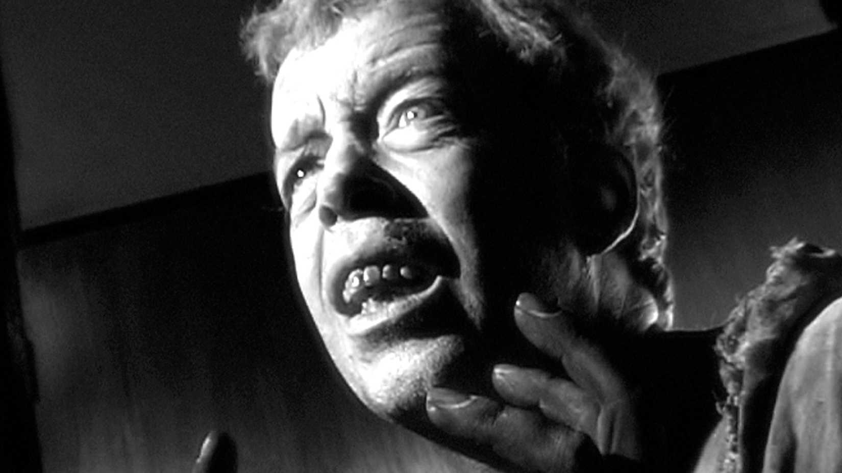 A scary man holds up his hands in Call of Cthulhu 2005