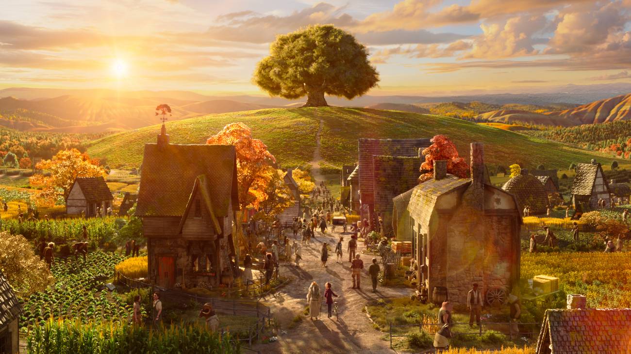 A village seen from a distance with a magnificent tree and a sunrise in the background in Wildwood