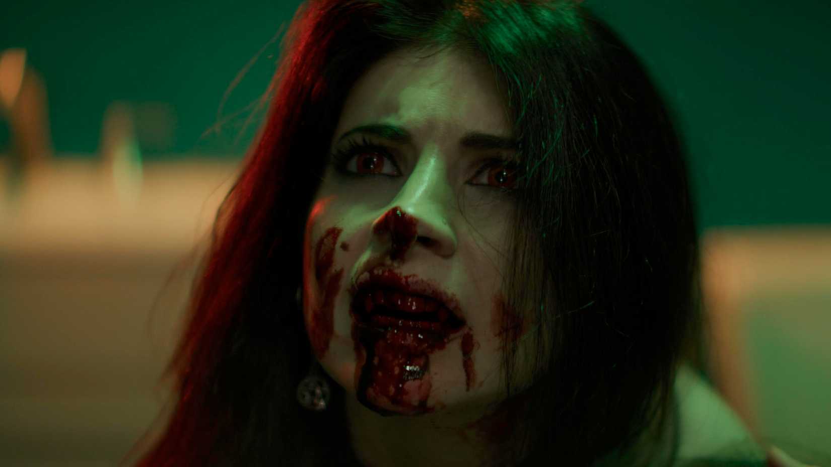 A woman with red eyes and covered in blood in DEVOUR 2025, 2026
