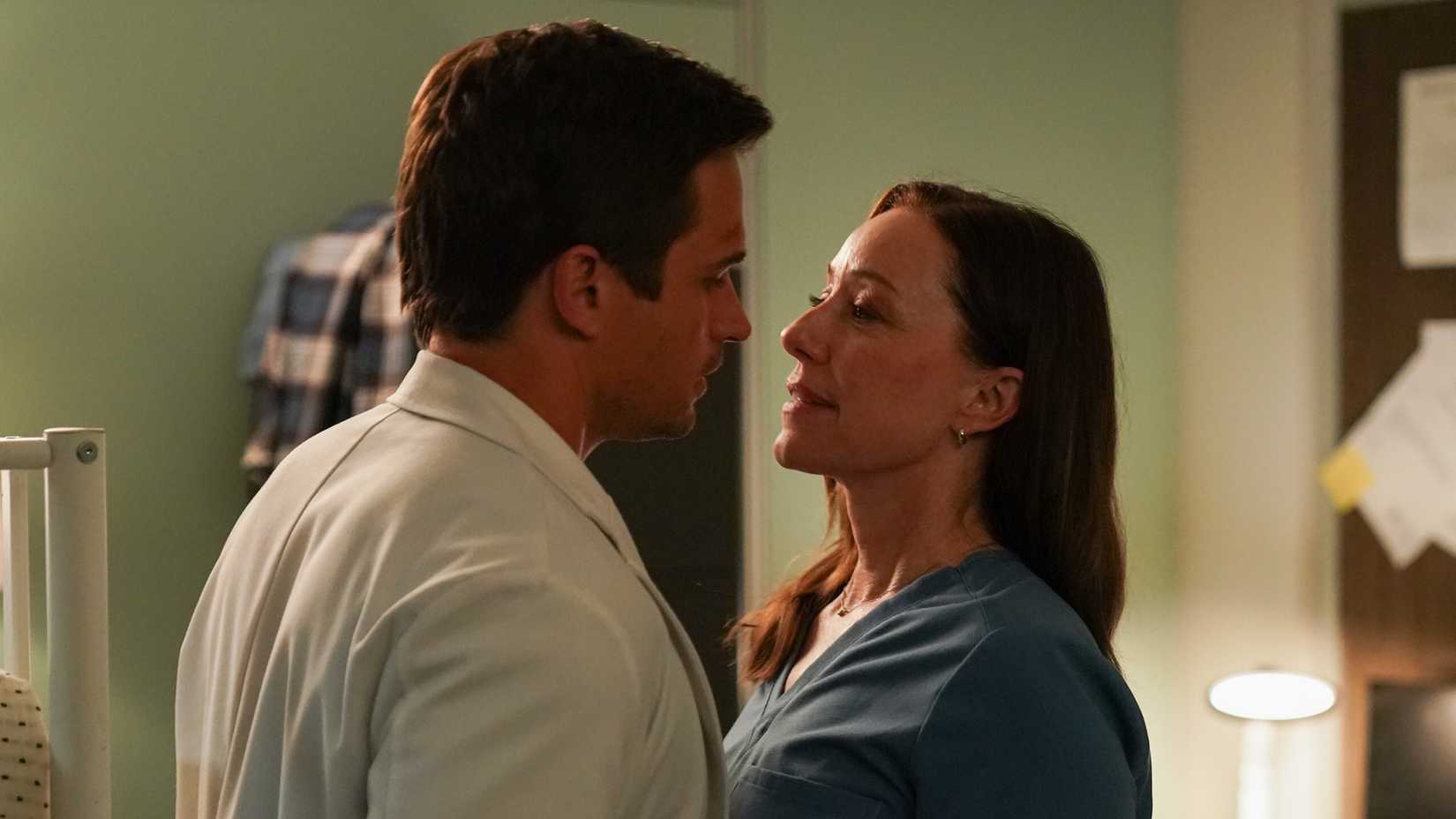 Amy and Jake about to kiss Doc