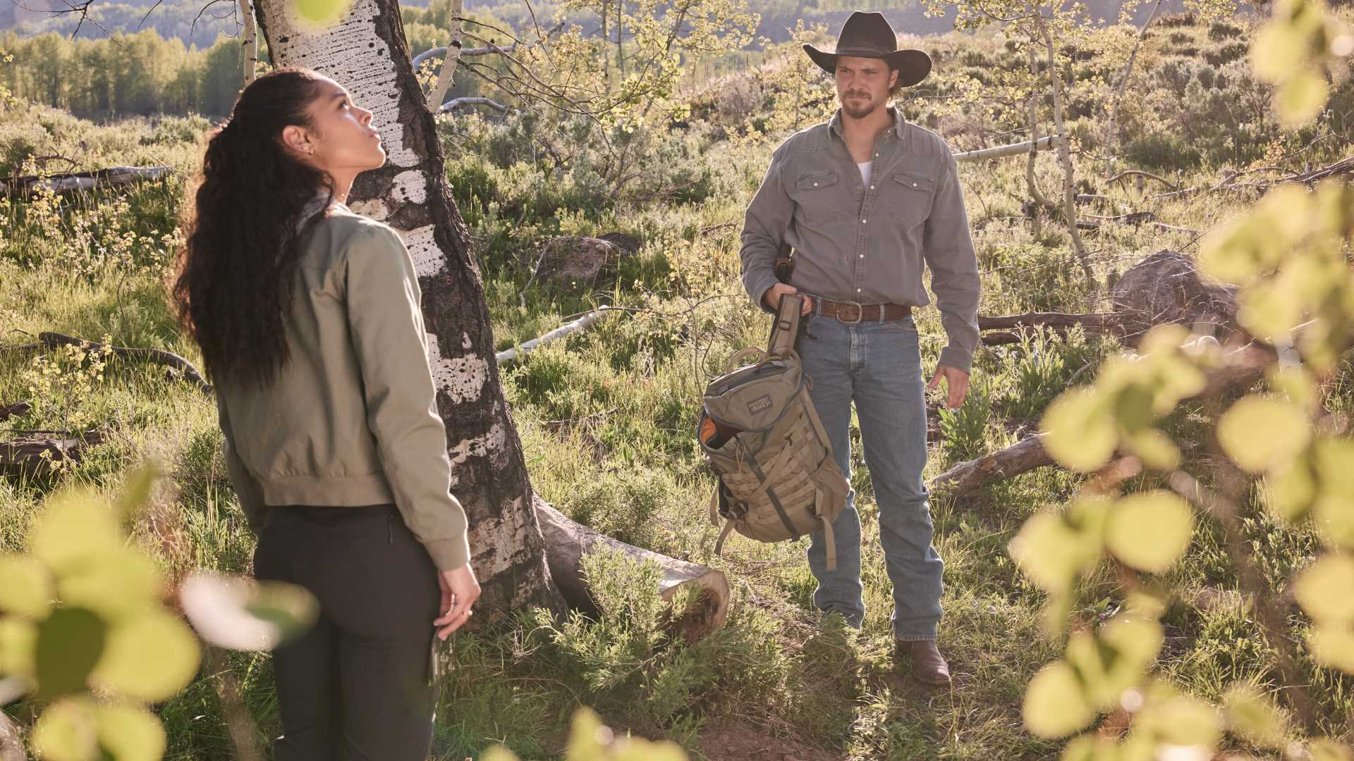Andrea Cruz looking up with Luke Grimes in Marshals