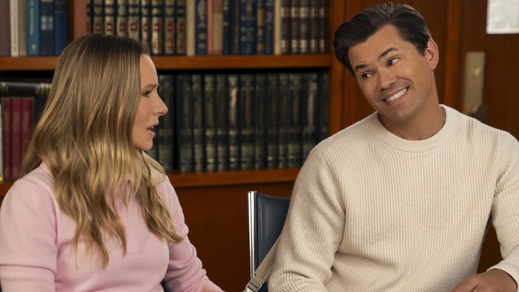 Andrew Rannells smiling passive aggressively at Kristen Bell in Nobody Wants This season 3
