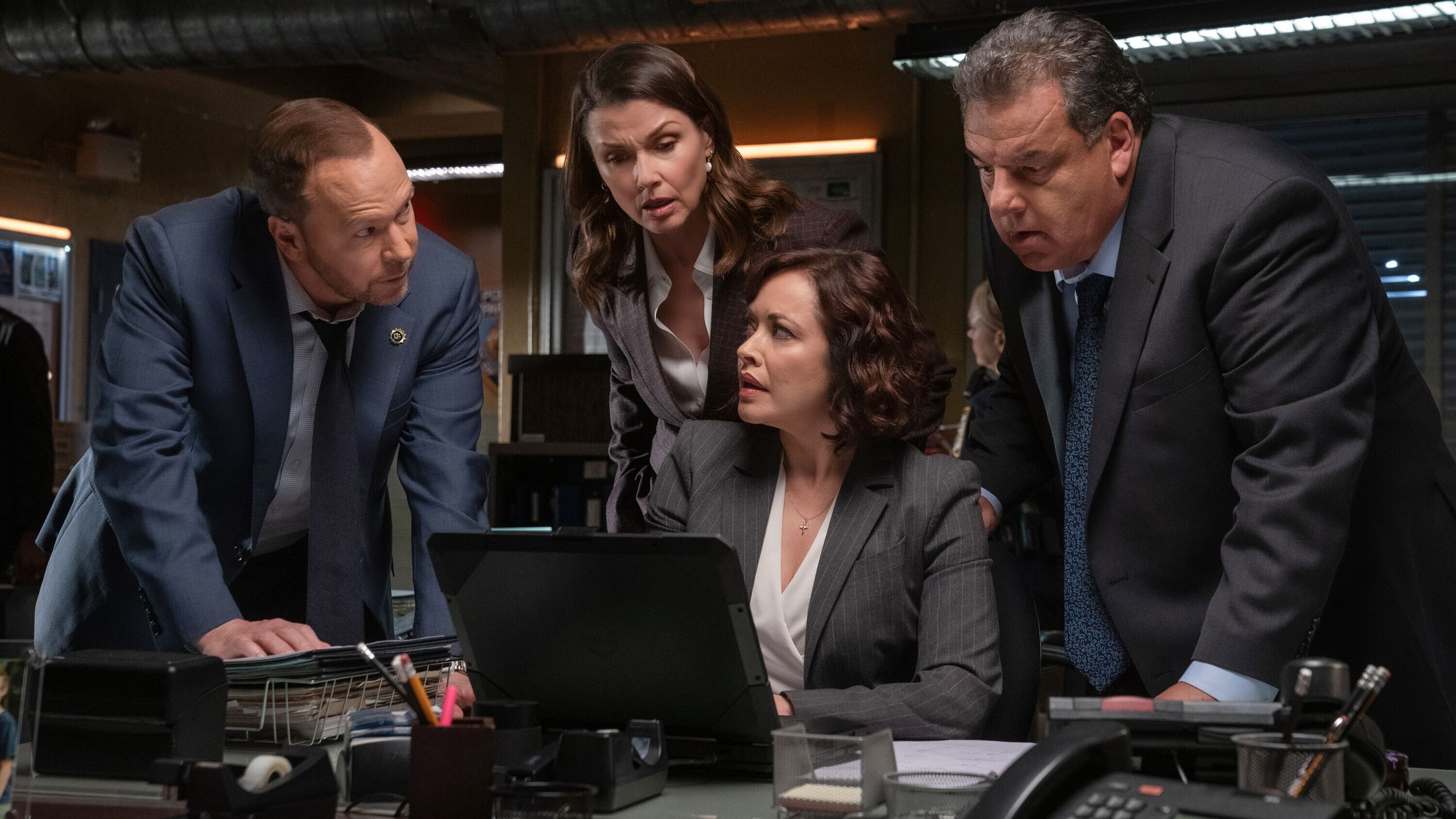 Still of Bridget Moynahan as Erin Reagan-Boyle, Donnie Wahlberg as Danny Reagan, Steve Schirripa as Anthony Abetemarco, and Marisa Ramirez as Maria Baez in Blue Bloods season 14.