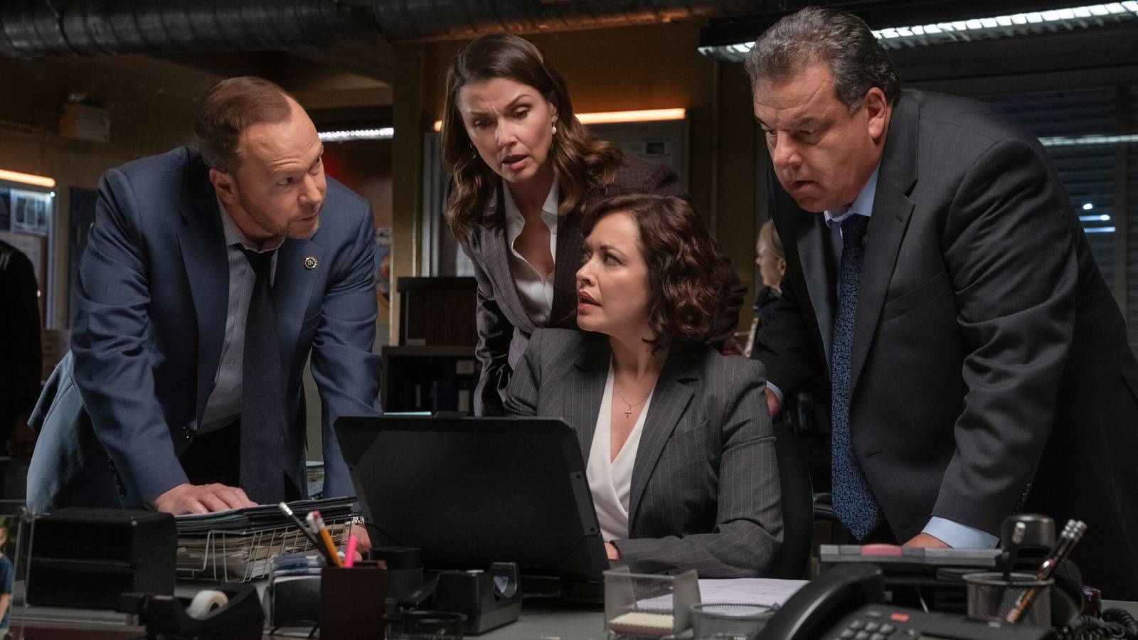 Still of Bridget Moynahan as Erin Reagan-Boyle, Donnie Wahlberg as Danny Reagan, Steve Schirripa as Anthony Abetemarco, and Marisa Ramirez as Maria Baez in Blue Bloods season 14.