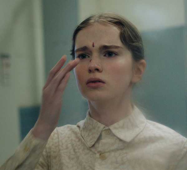 Carrie with a drop of blood on her face in Prime Video's Carrie TV show