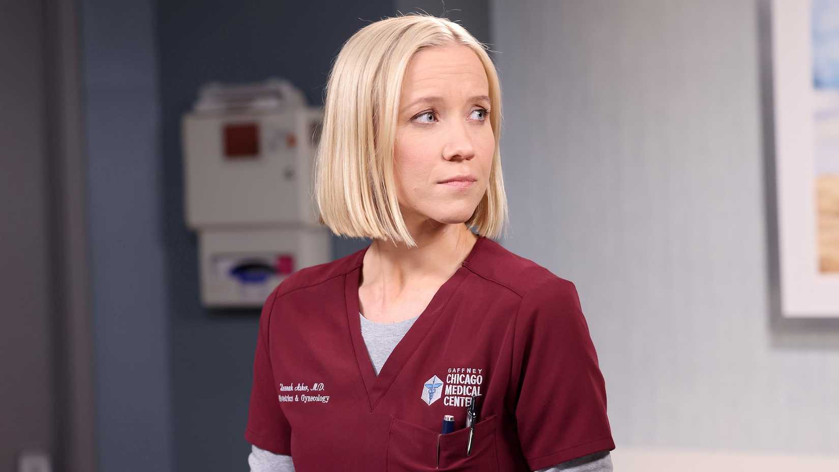 Dr. Hannah Asher wearing crimson-colored scrubs