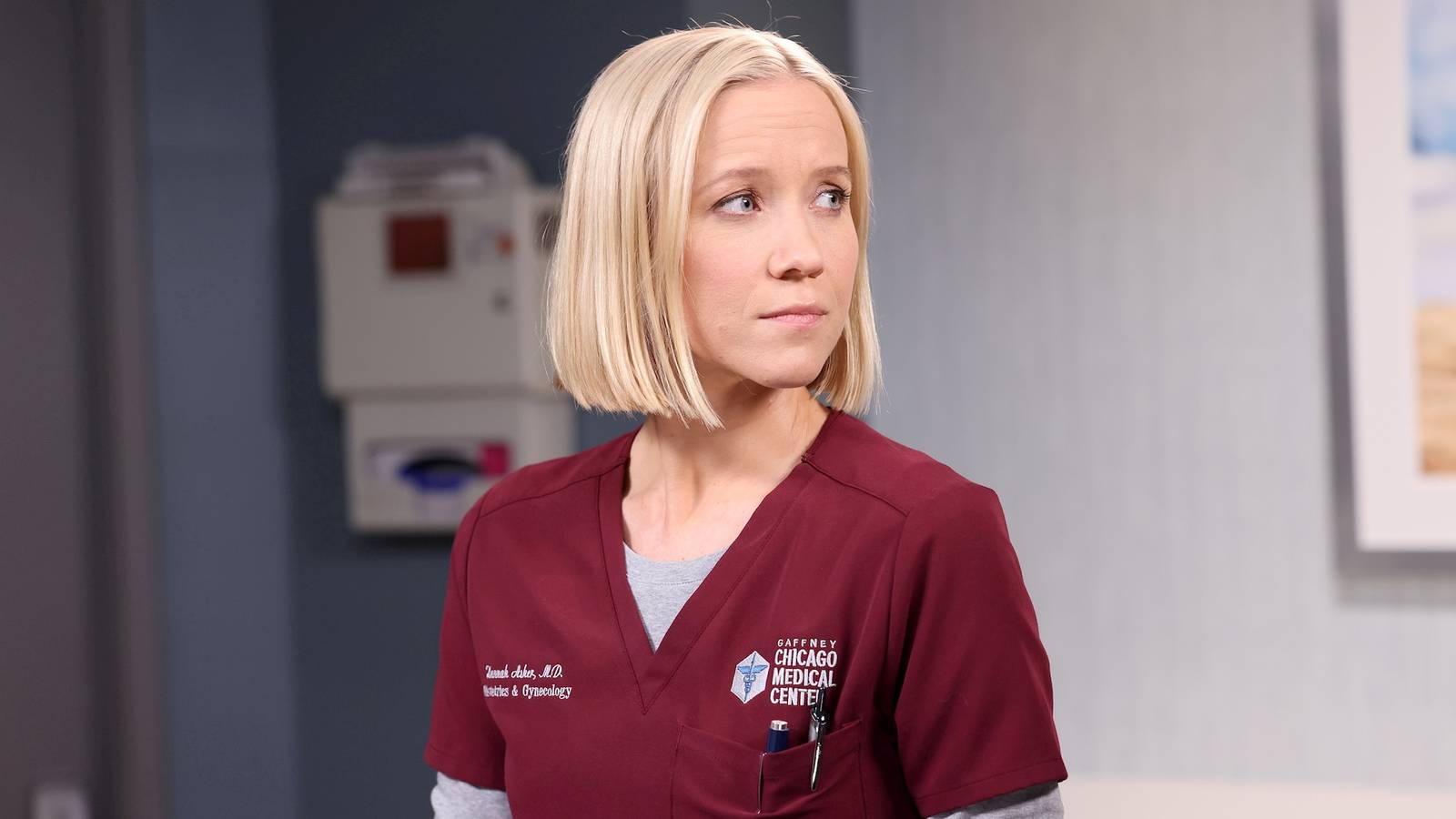 Dr. Hannah Asher wearing crimson-colored scrubs