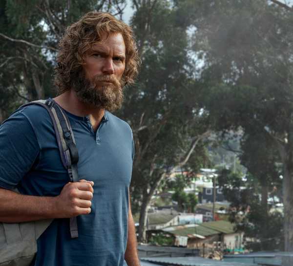 Chris Pratt as James Reece with long hair and a backpack on his shoulder in The Terminal List season 2