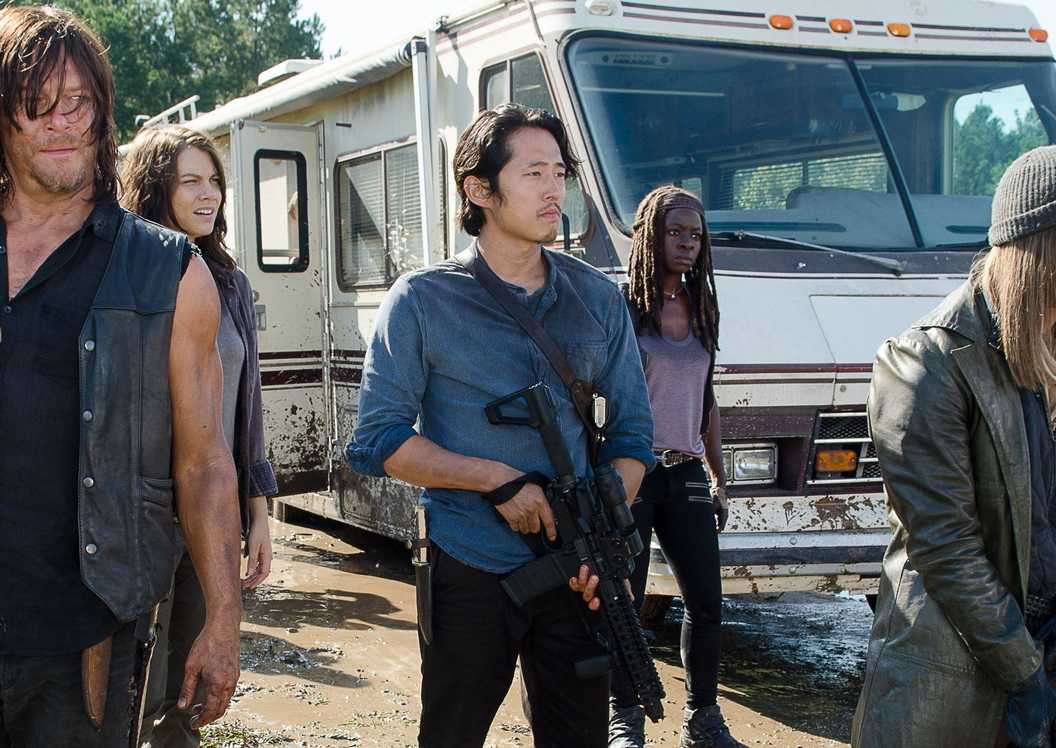 Daryl, Maggie, Jesus, Michonne, Rick, and Glenn standing in front of an RV in The Walking Dead season 6