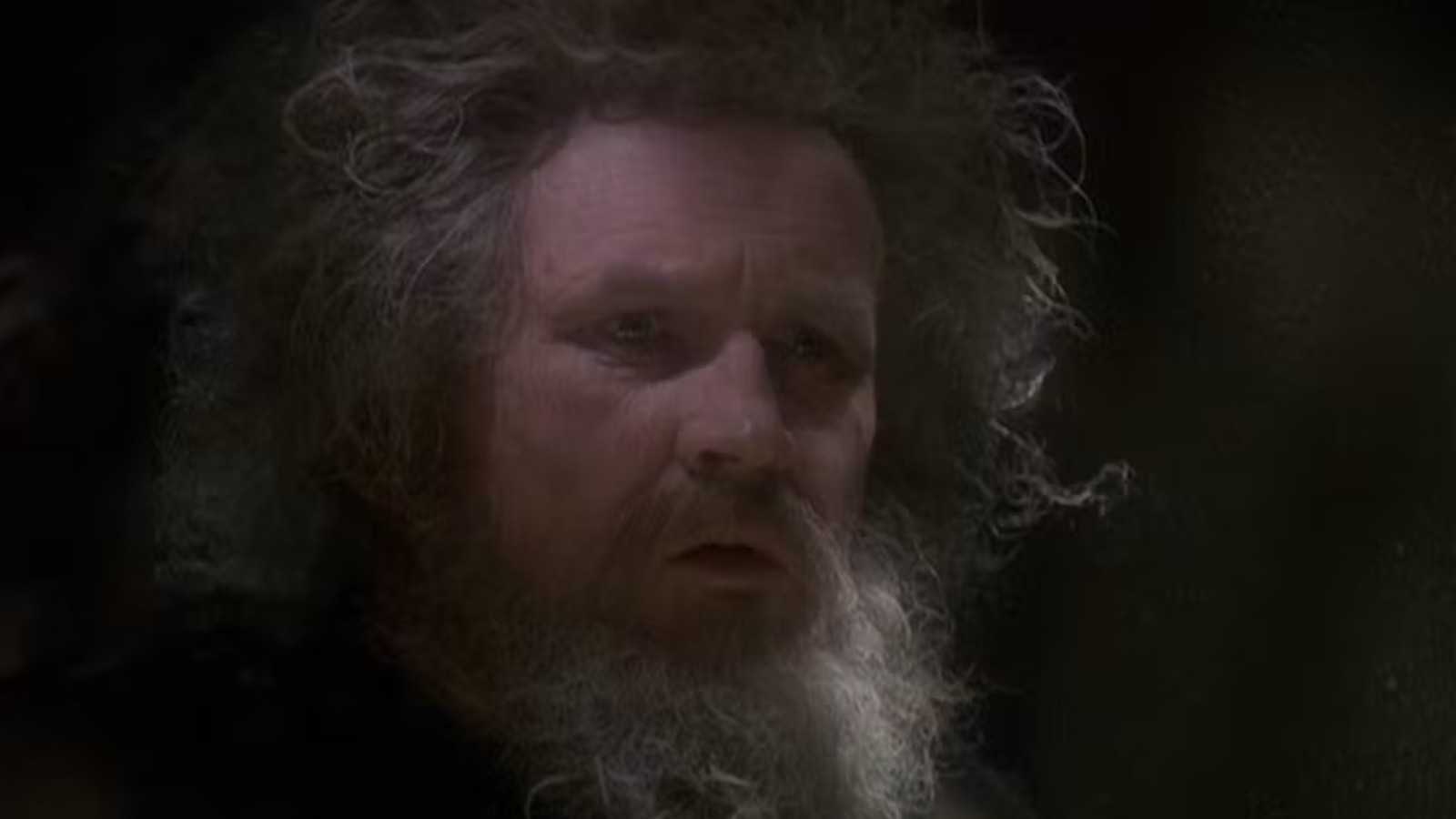 Miles O'Brien with a large, tangled beard that matches his long, dirty hair after being held in prison for 20 years.
