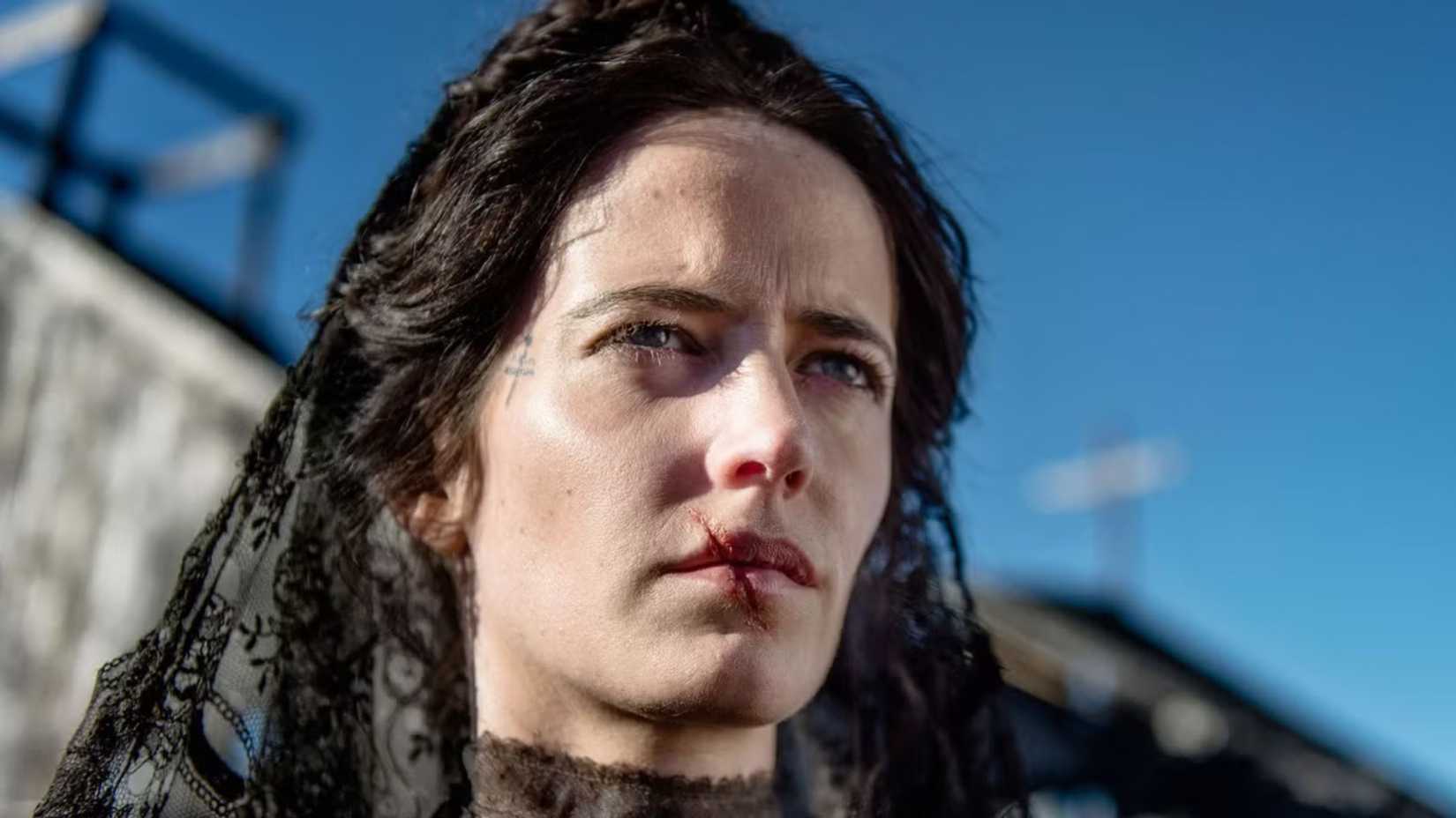 Eva Green looks out with a scar in The Salvation