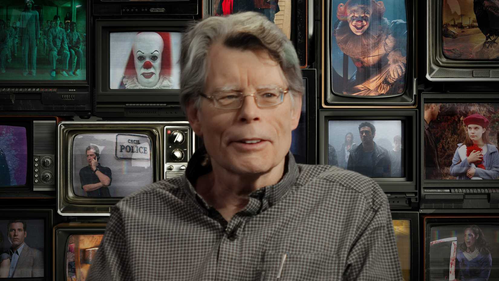 Stephen King is in front of TV screens with his adaptations on them