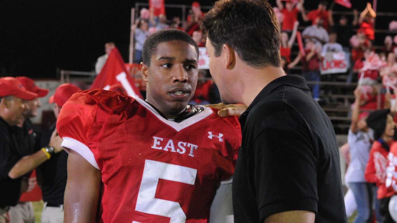 Michael B Jordan on the football field in Friday Night Lights