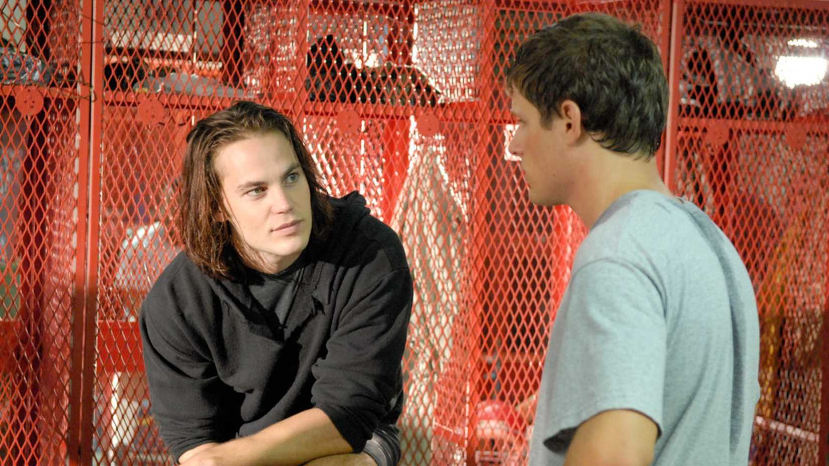 Taylor Kitsch as Tim Riggins in a locker room in Friday Night Lights