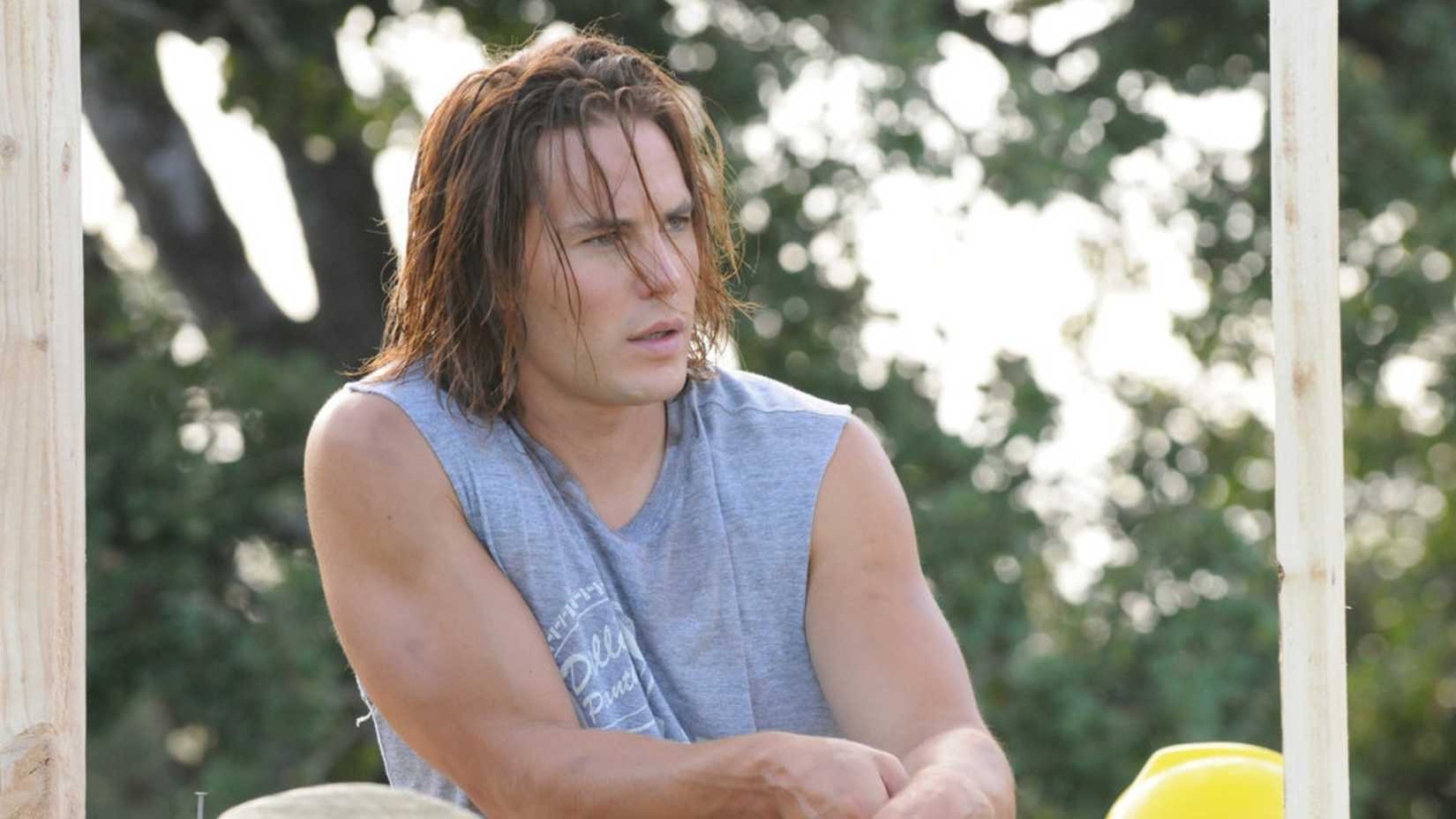 Tim Riggins on a porch in Friday Night Lights