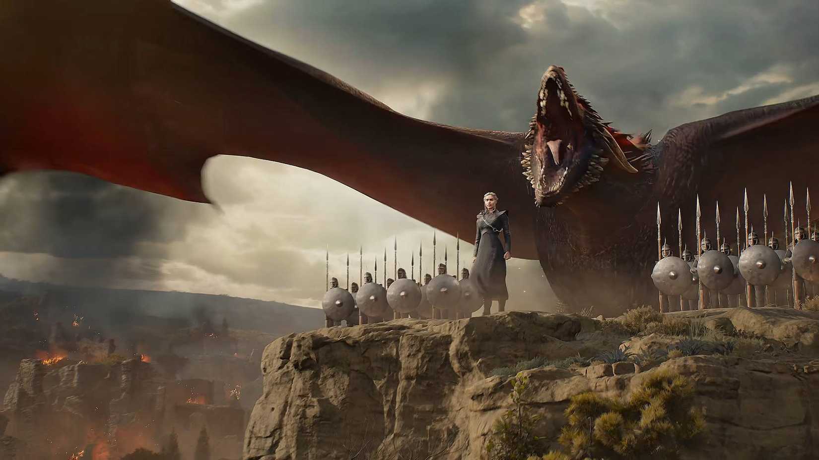 Daenerys standing with her soldiers and dragon in Game of Thrones: War for Westeros.