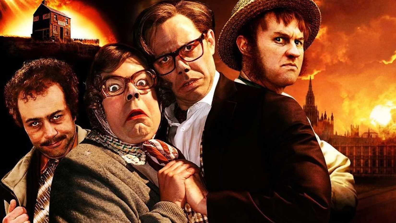 Geoff, Eddie, Tubs, an Hilary stand in front of a burning town in The Leage of Gentlemen's Apocalypse