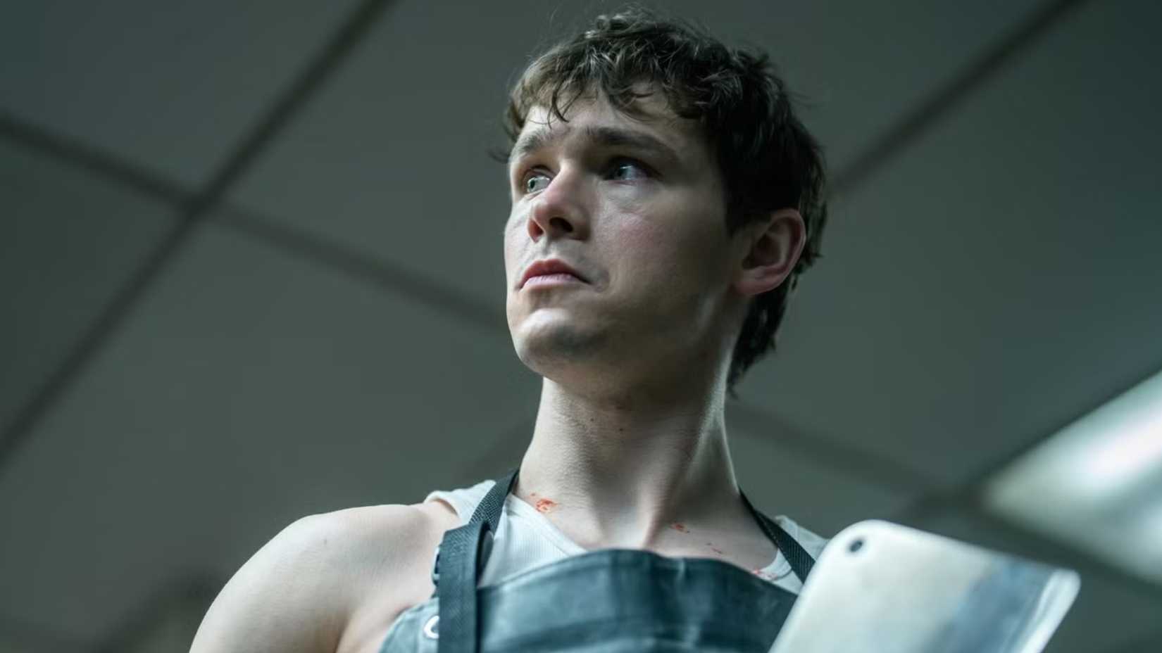 Jack Alcott as Harrison Morgan wearing an apron in Dexter Resurrection