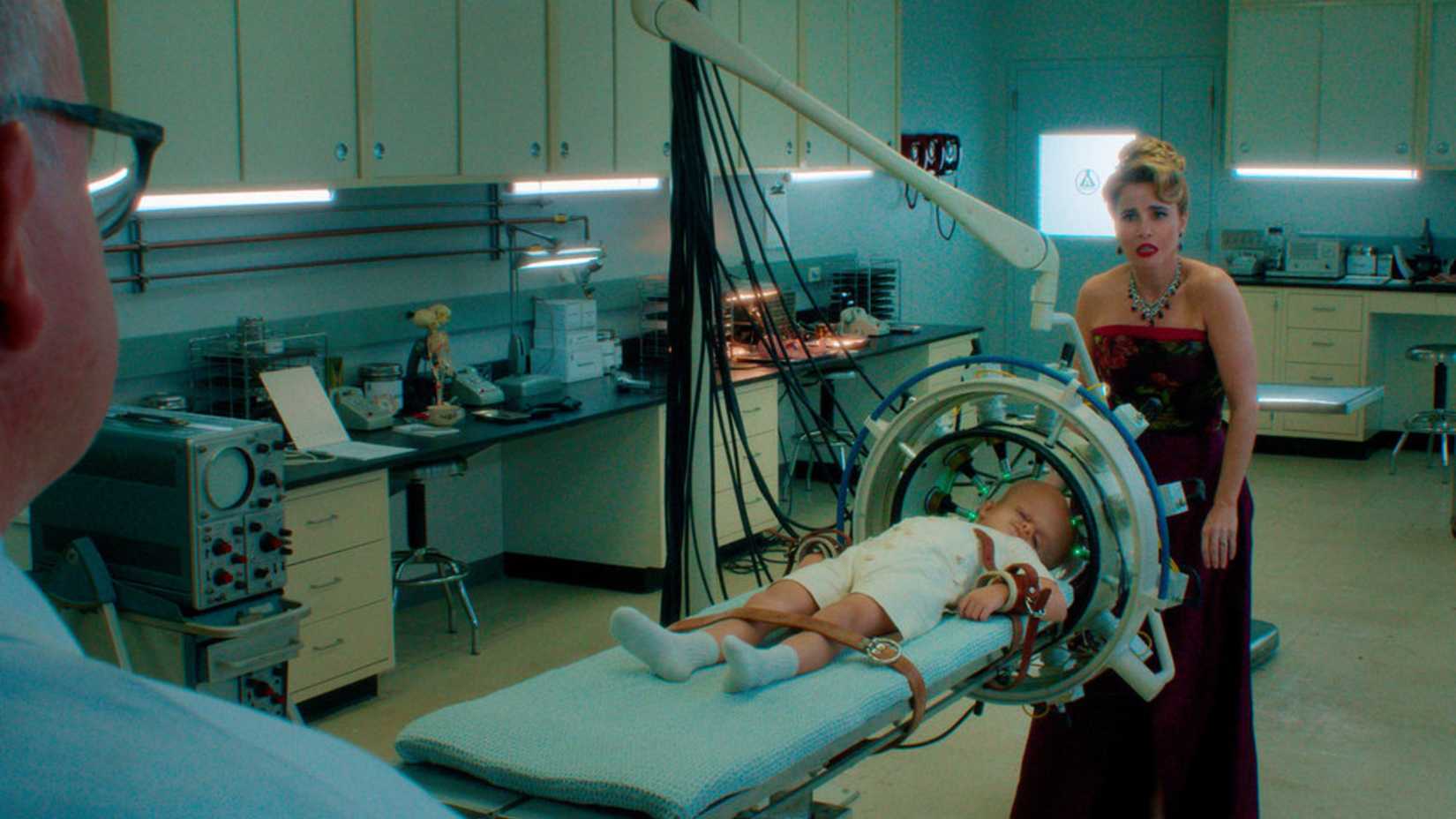 Jason is strapped to a table and Pamela Voorhees looks upset