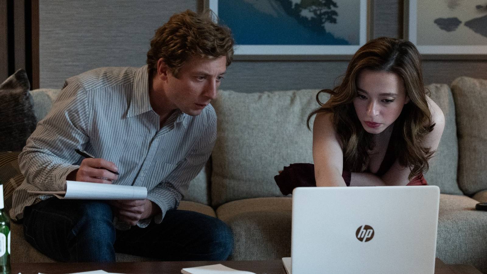 Jeremy Allen White and Mikey Madison looking at a computer screen in The Social Reckoning