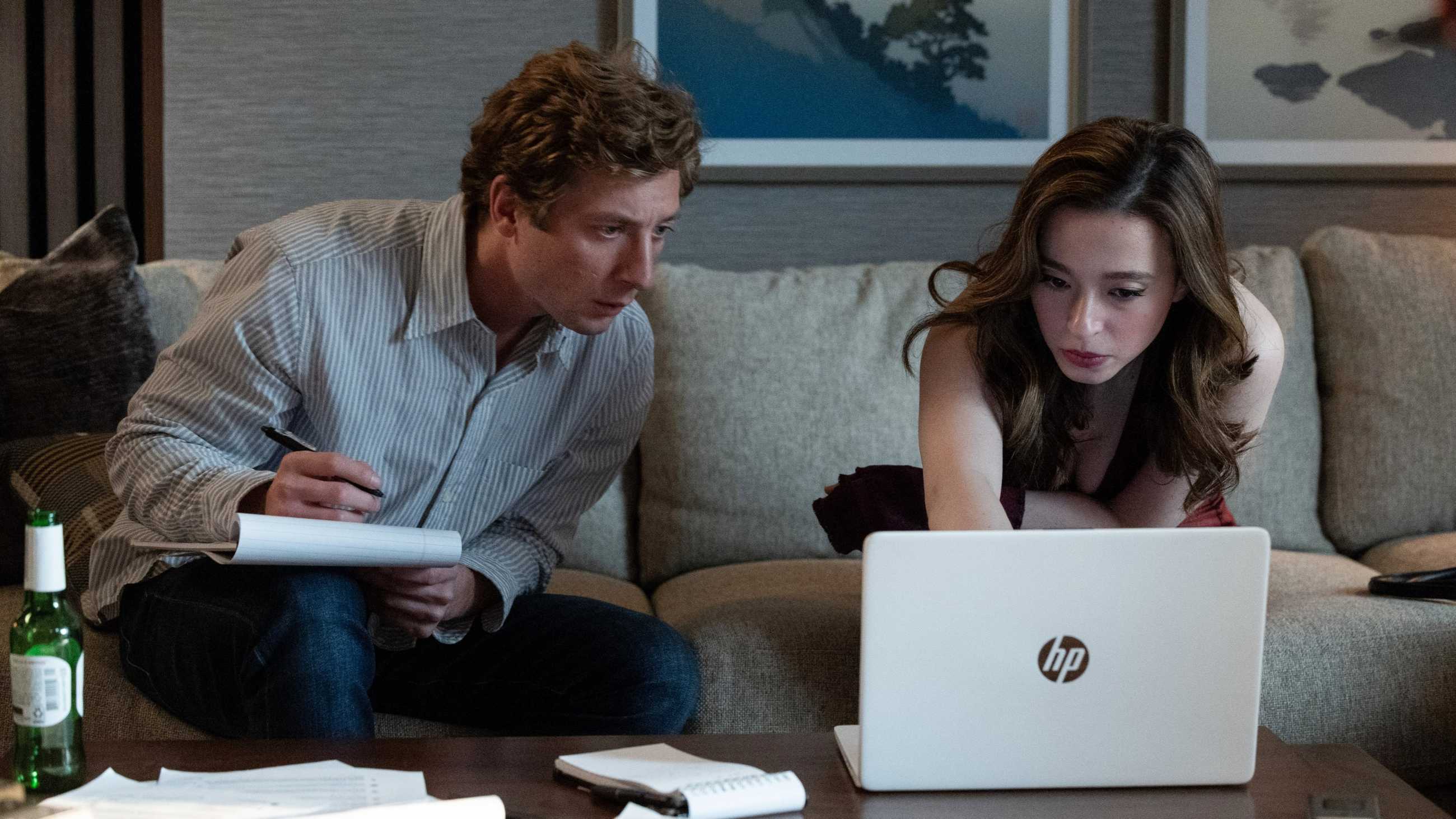 Jeremy Allen White and Mikey Madison looking at a computer screen in The Social Reckoning