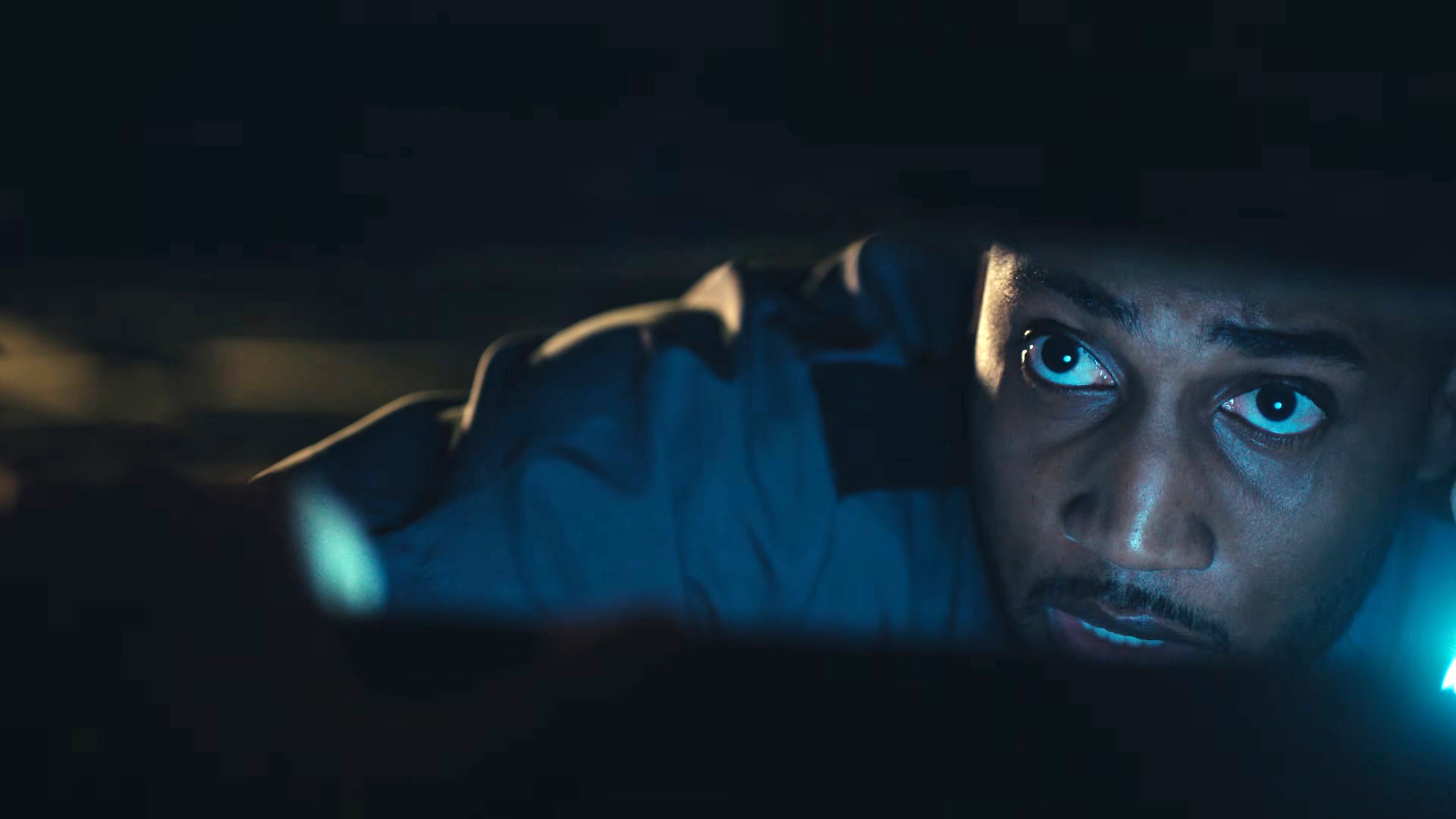 jonathan-o-neil-s-deputy-anderson-looking-through-slats-in-a-window-in-biohazard How Chandler Riggs Went From The Walking Dead To Resident Evil's Most Accurate Adaptation Yet