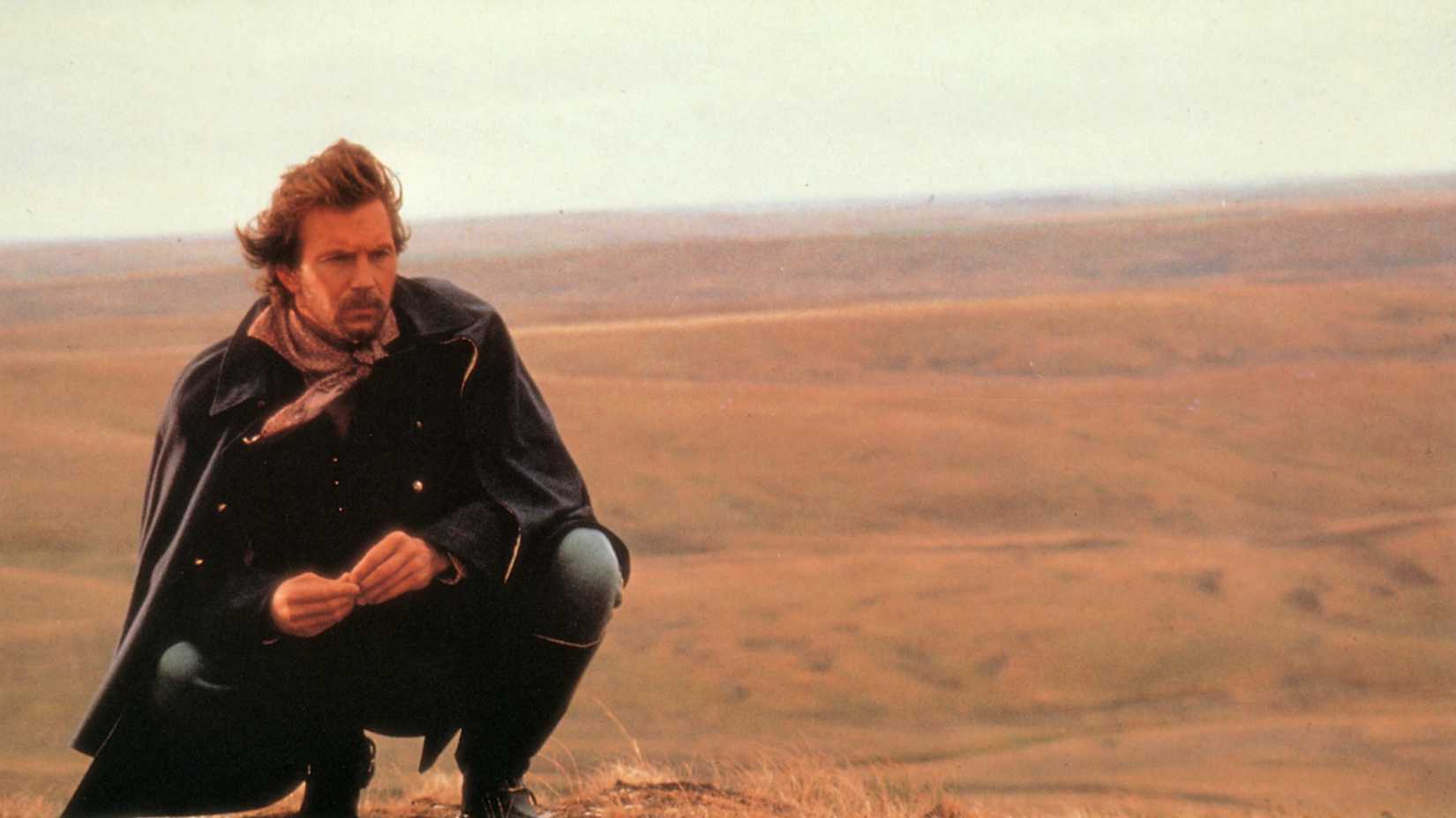 Kevin Costner as Lieutenant Dunbar kneeling in Dances With Wolves