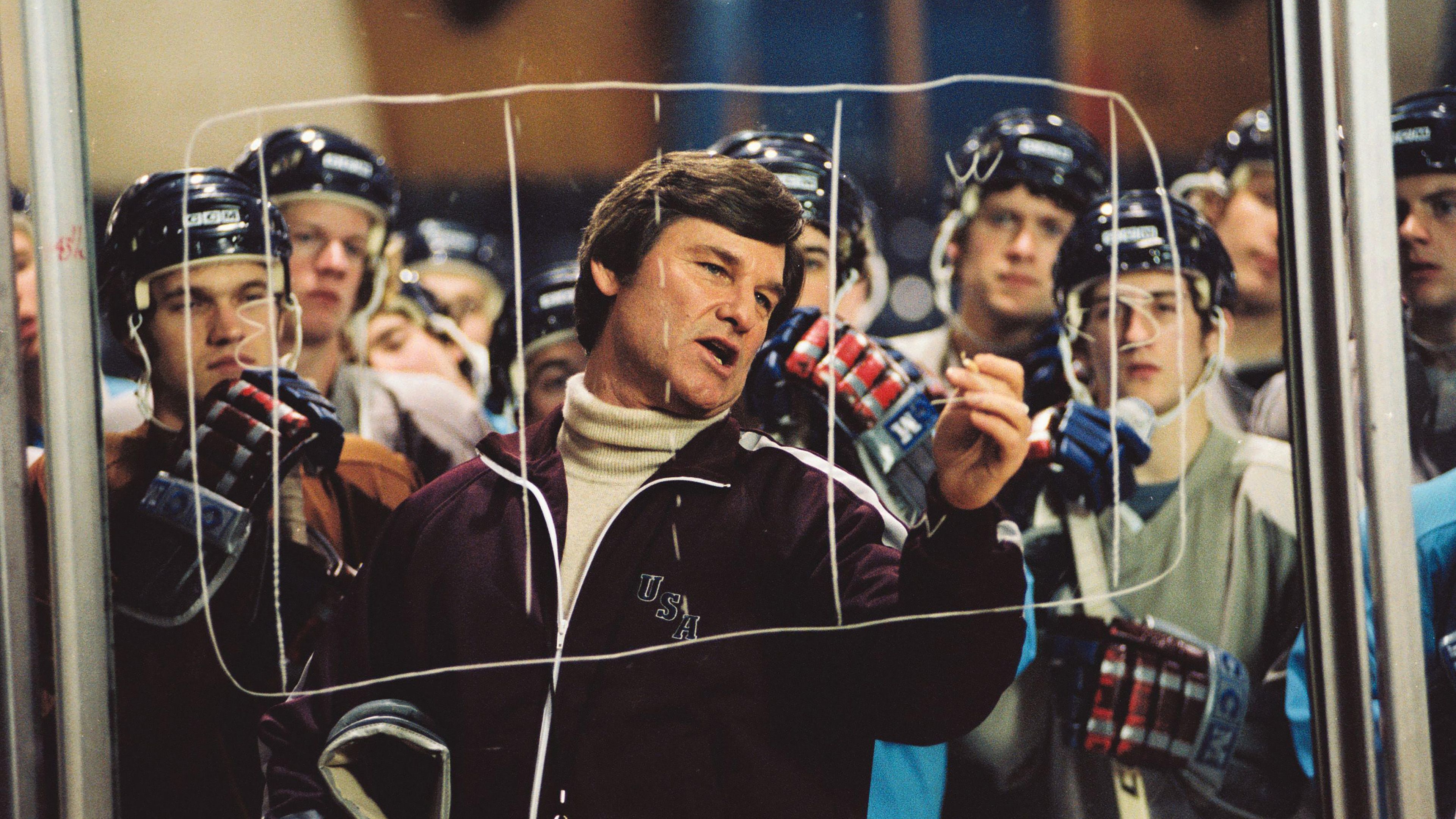 kurt-russell-s-herb-drawing-a-play-out-on-a-pane-of-rink-glass-in-miracle Kurt Russell’s Iconic 136-Minute Historical Drama Officially Sets New Streaming Release Date