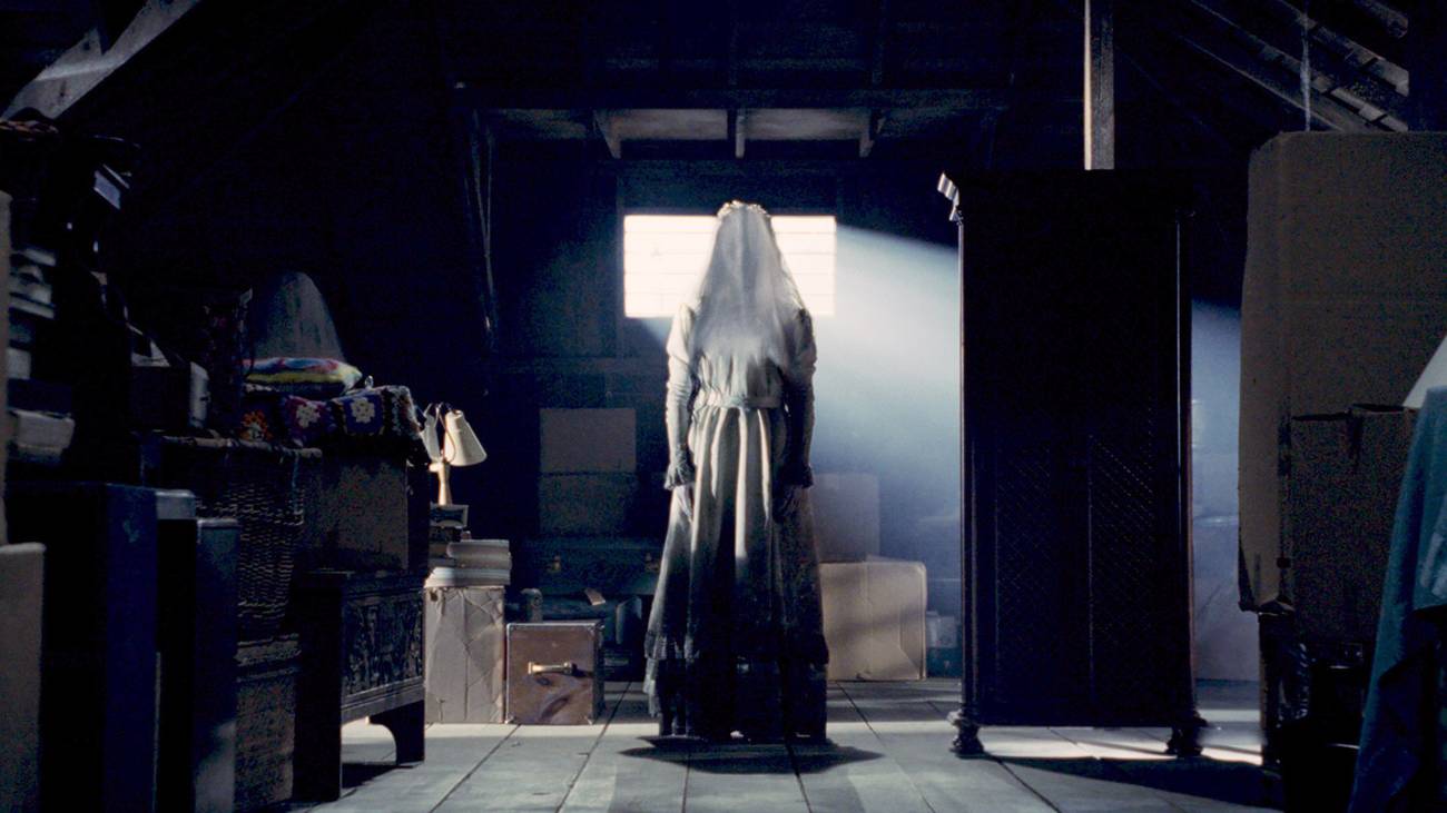 La Llorona standing in an attic in The Curse of La Llorona