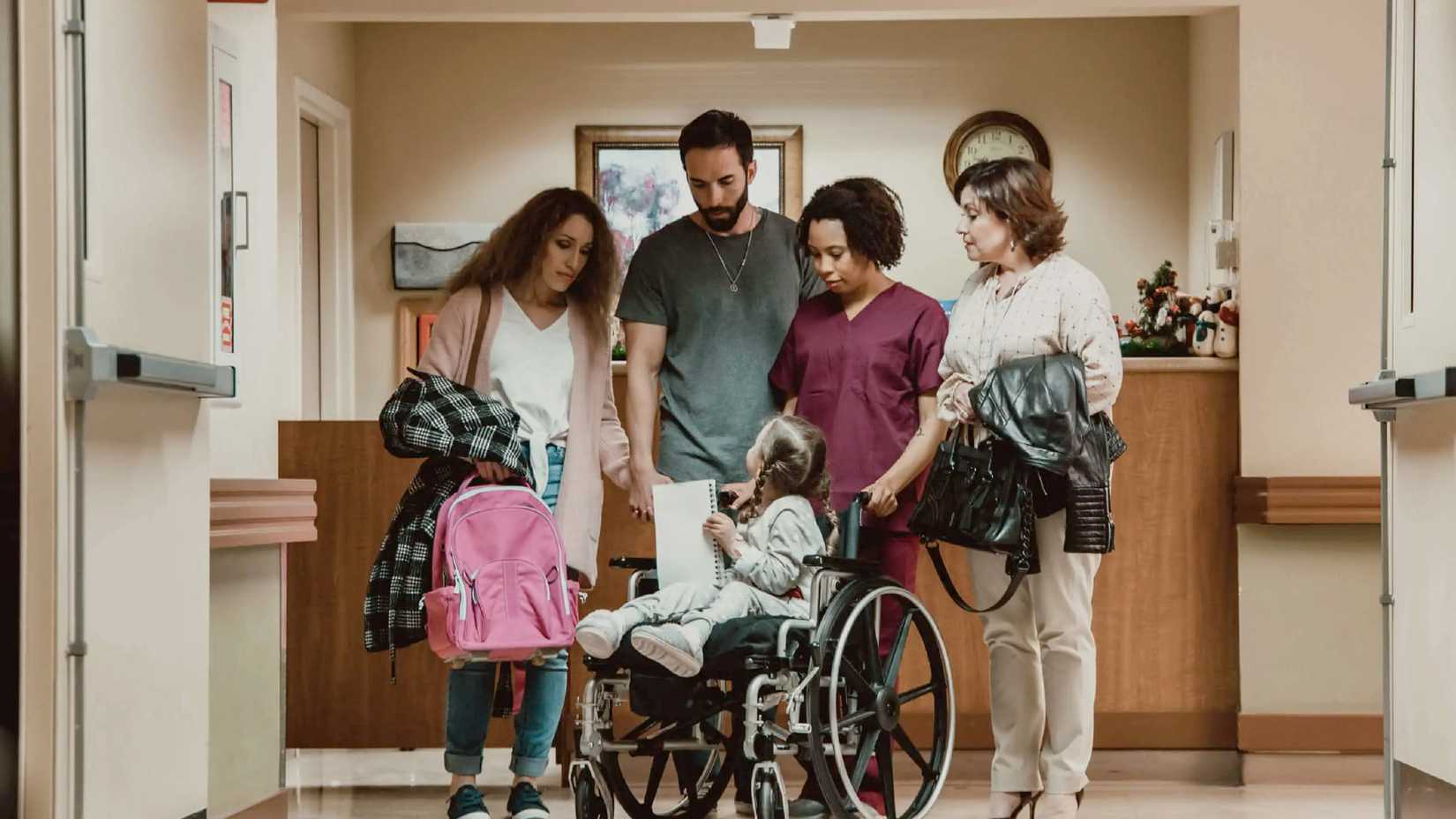 Lucy surrounded by her family in hospital in Lucy Shimmers and the Prince of Peace