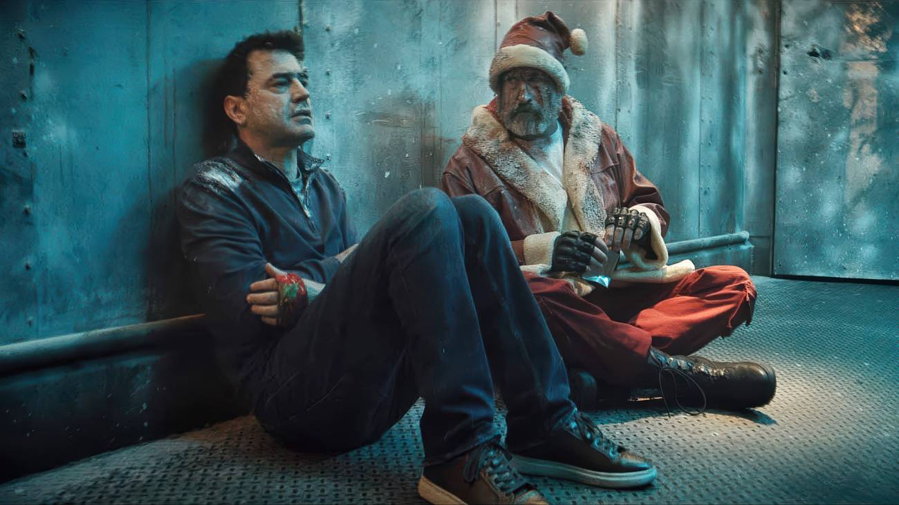 Mark and the mall Santa talking to each other in a walk-in freezer in Christmas at the Kringles