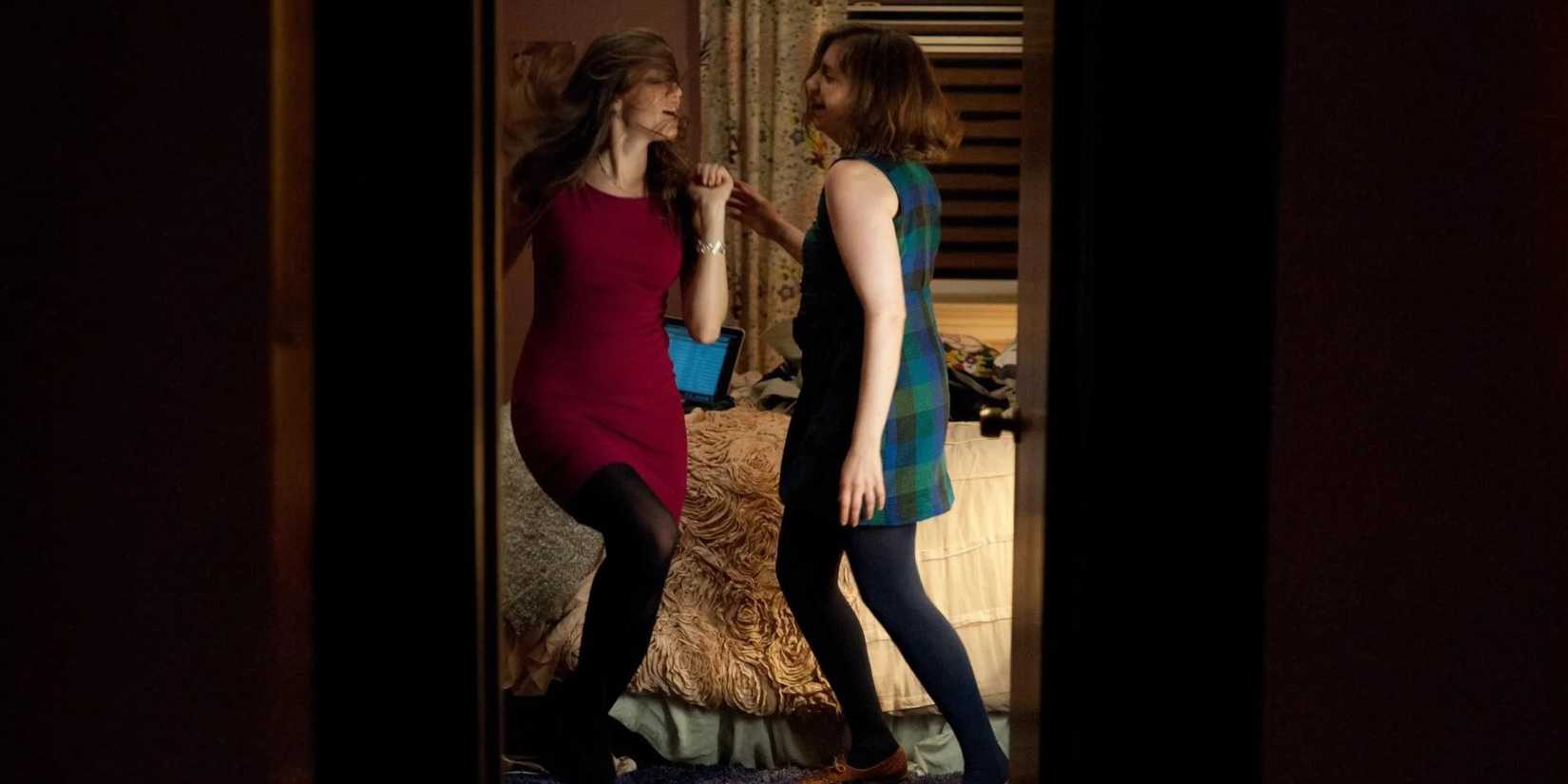Marnie and Hannah dancing together in Girls