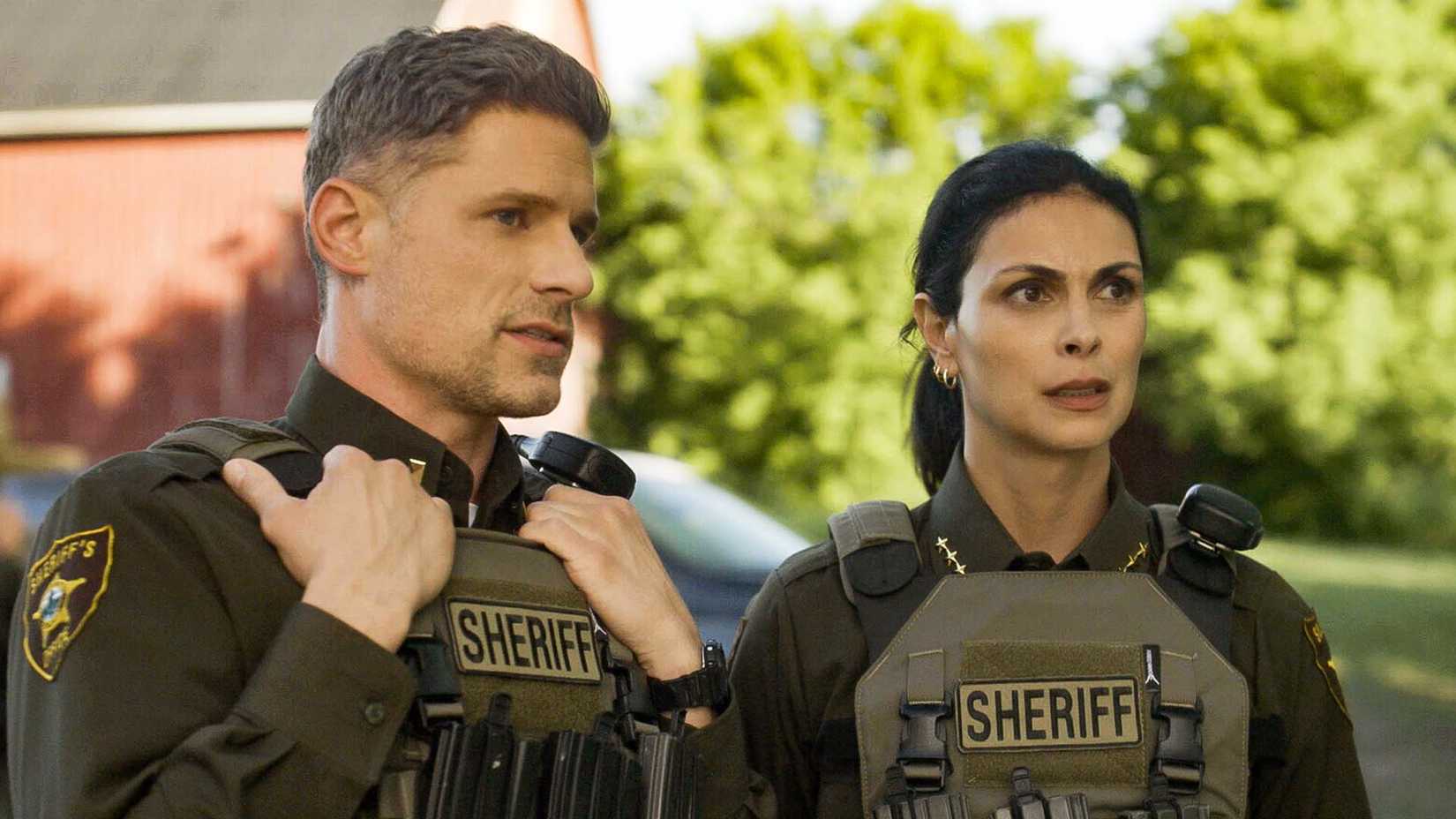 Matt Lauria as Deputy Nate Boone and Morena Baccarin as Sheriff Mickey Fox in Sheriff Country