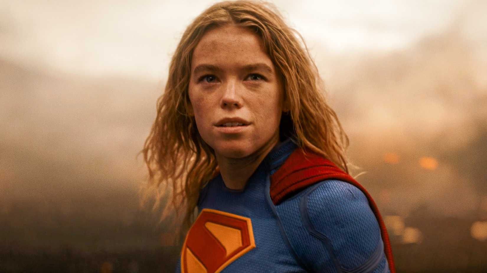 Milly Alcock cracking a smile in Supergirl