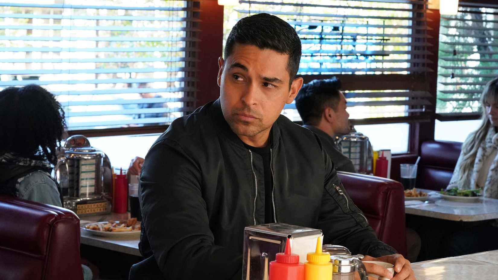 Nick Torres seated at a diner counter