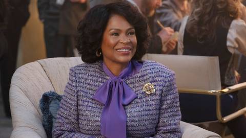 Nia Long as Katherine Jackson smiling and sitting in Michael