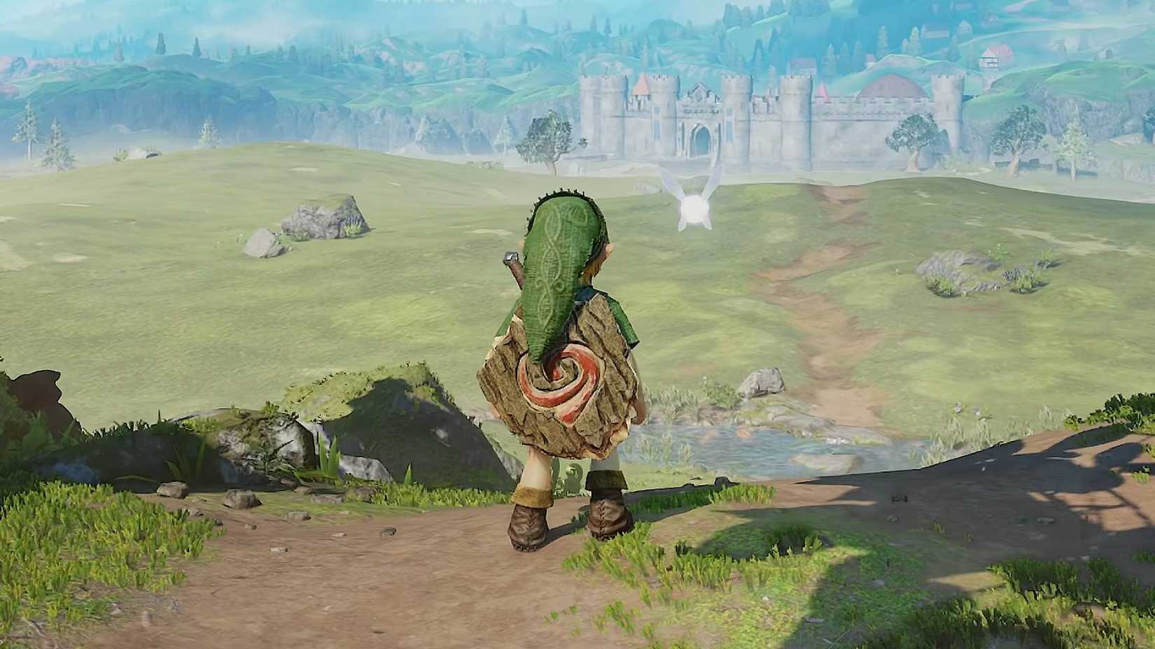 Link standing looking at Hyrule Castle and Hyrule Field in The Legend of Zelda: Ocarina of Time.