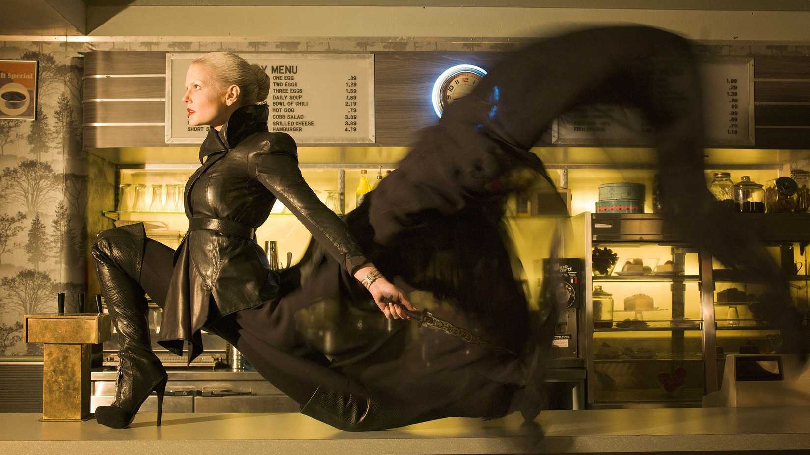 Jennifer Morrison as Emma Swan with a magical black trail behind her in Once Upon A Time.