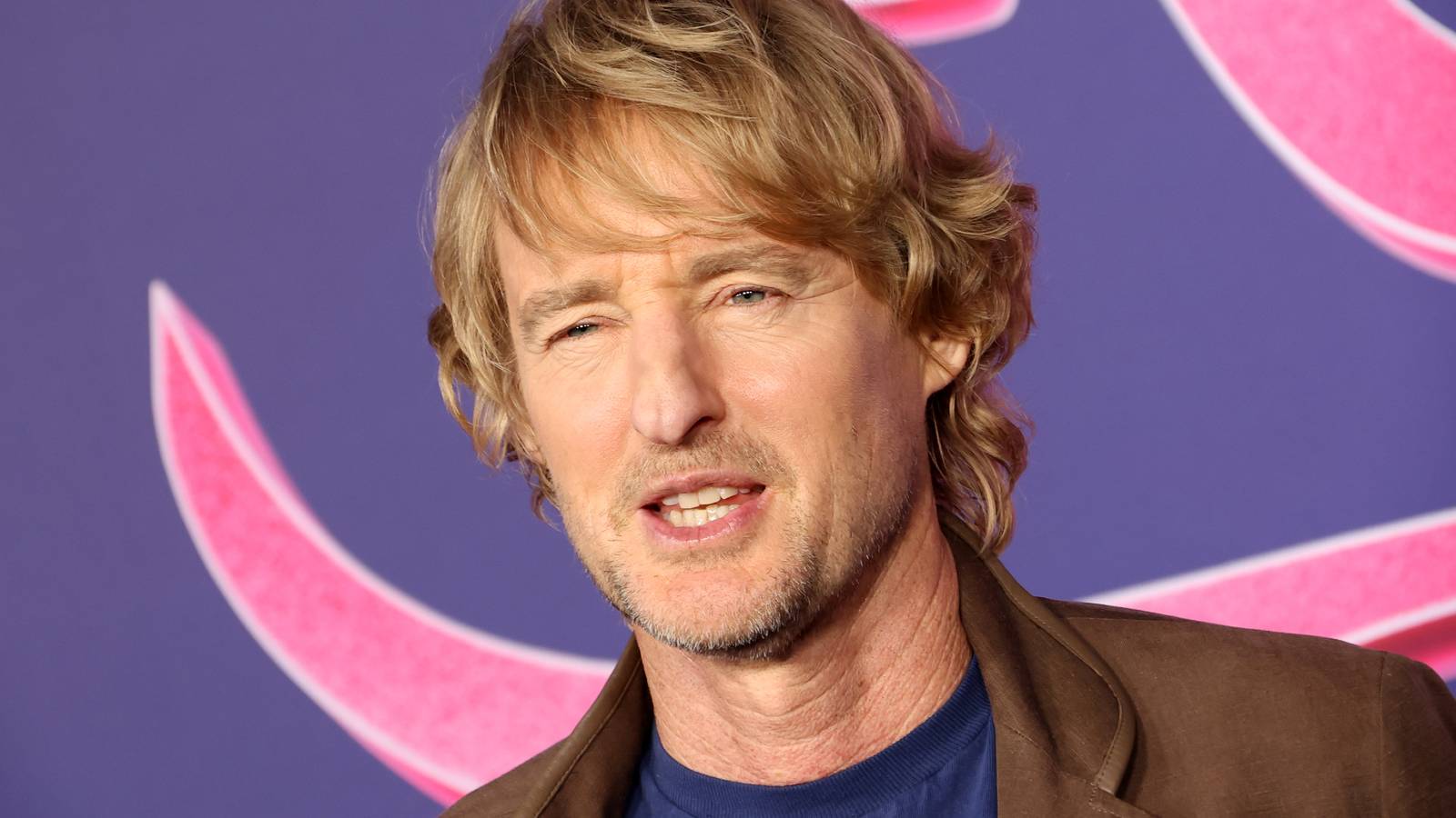 Owen Wilson posing on the red carpet for Rolling Loud The Movie