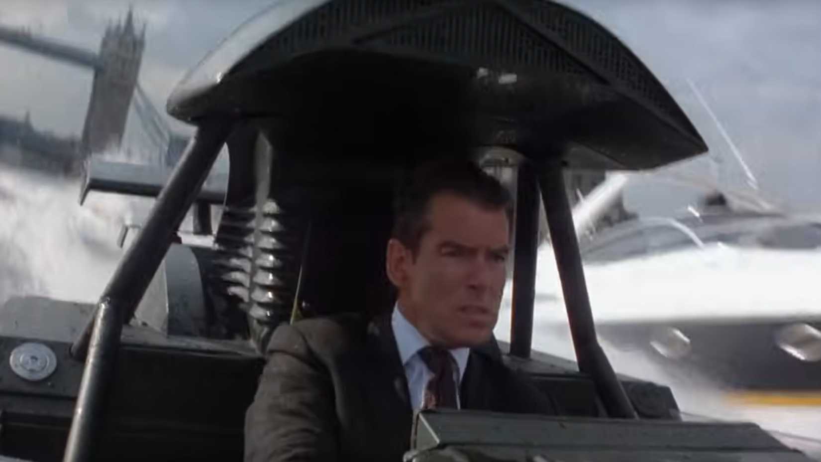 Pierce Brosnan in a speedboat on the thames in the world is not enough