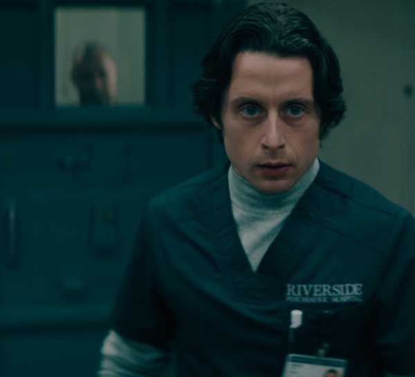 Rory Culkin as Karl walks away from Jurek's cell door in Nocturne on Apple TV