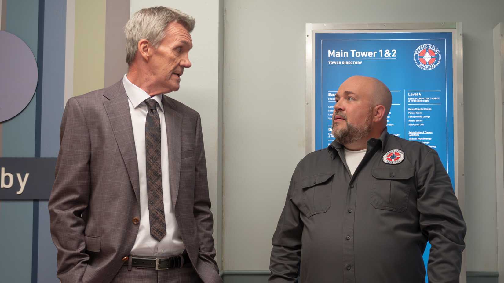 The Janitor and the Maintenance Guy share a look in Scrubs season 2, episode 4.