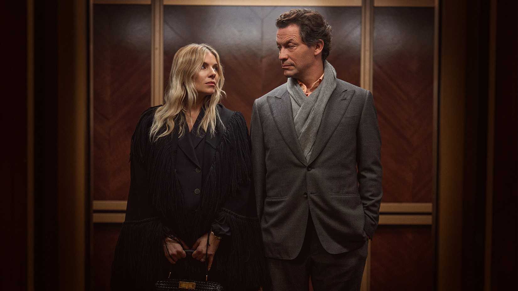 SIenna Miller and Dominic West looking at each other in War